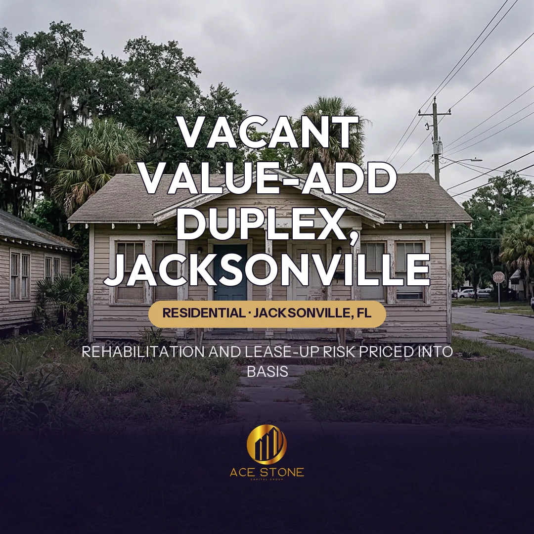 Older but structurally sound vacant duplex in a Jacksonville neighborhood.