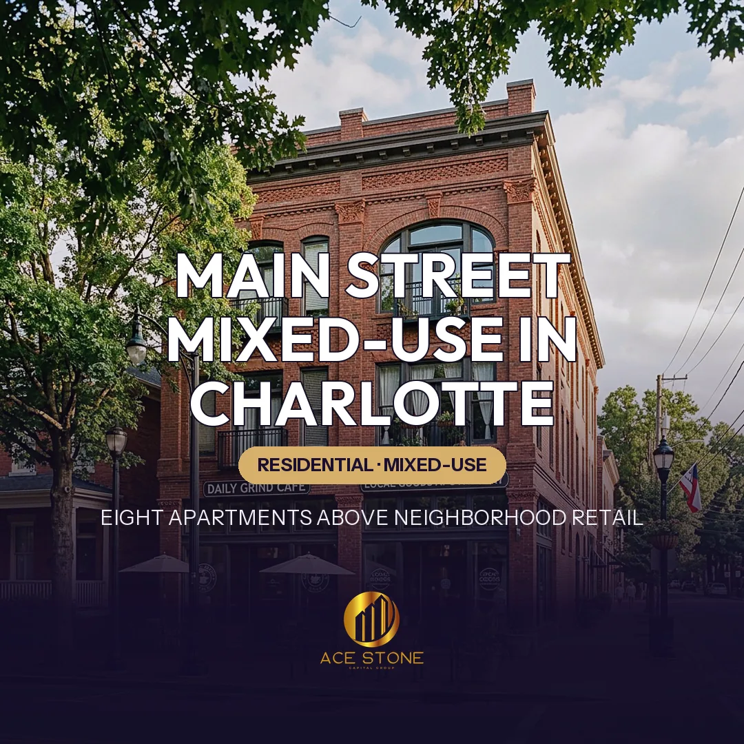 Brick main-street mixed-use building in a revitalized Charlotte neighborhood with cafes below and apartments above.