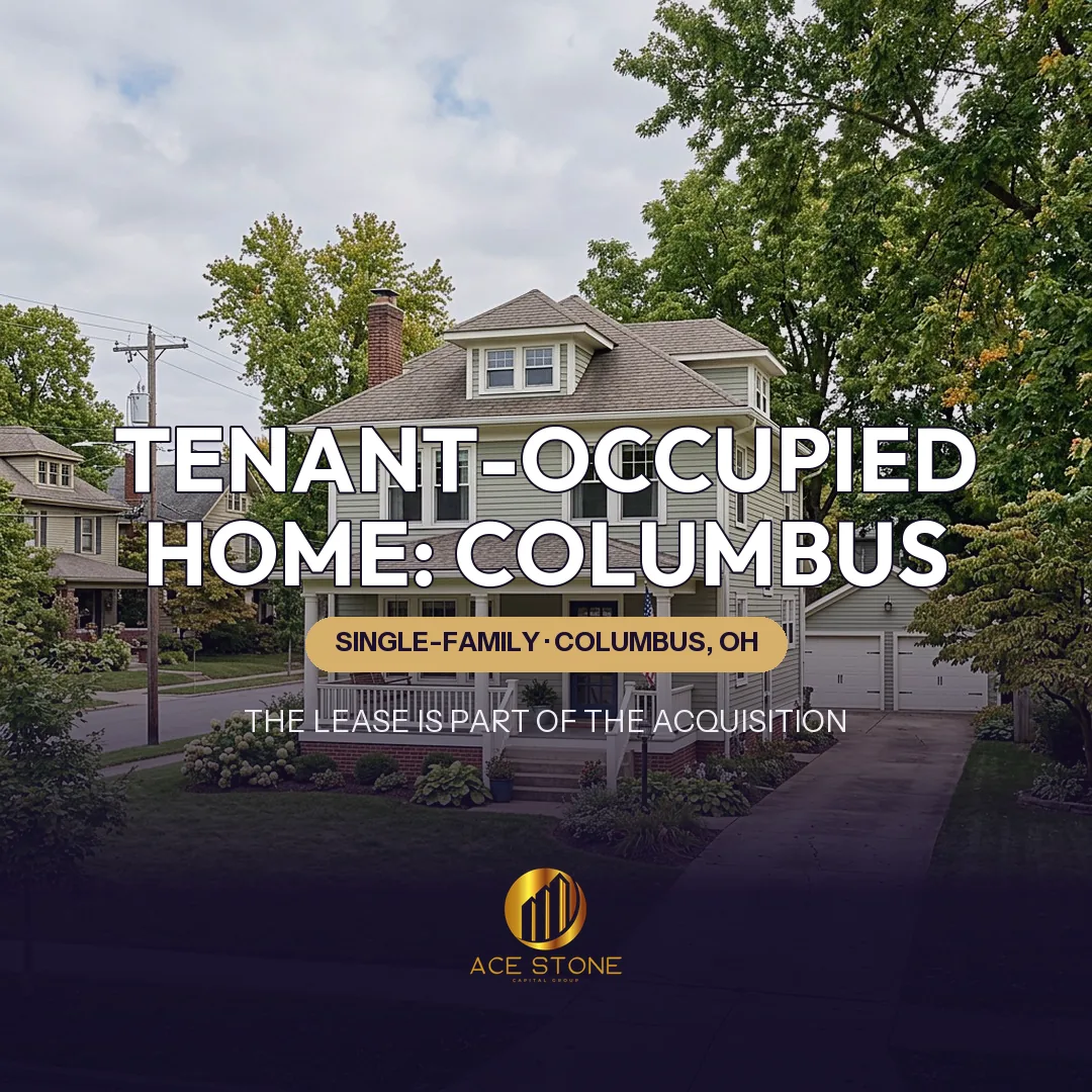 Clean detached Columbus Ohio single-family home with driveway and mature trees.